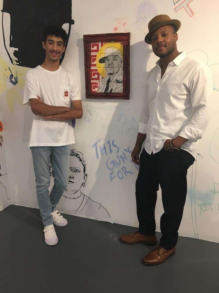 Artist Tyler Reid with Titus Kaphar, in front of Tyler's work "Gold" honoring Titus, 2018. Photo credit Artspace Staff.