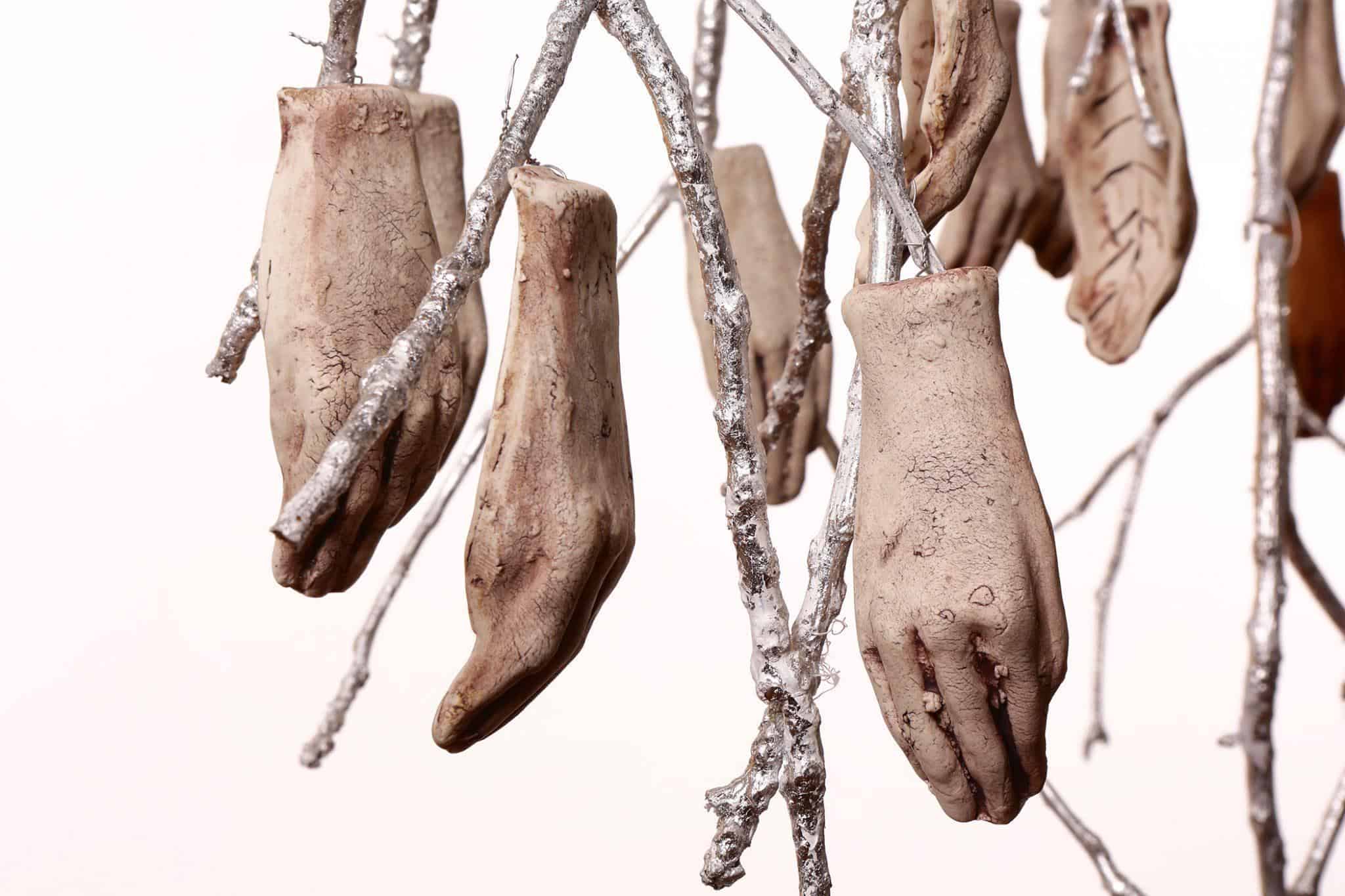 Jocelyn Braxton Armstrong, Our Hands in Your Hands (detail), 2018. Red clay, porcelain, engobe, oxide, branches, driftwood, paint, silver leaf, wire, 78” x 24” x 20”.
