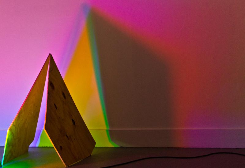 Lindsay Packer, Why do we have days and nights?, 2016. Red, green, and blue lights, plywood.